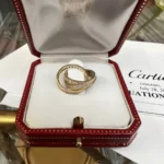 Bague authentique cartier en or trinity et diamants, taille 4 1/4, excellent état